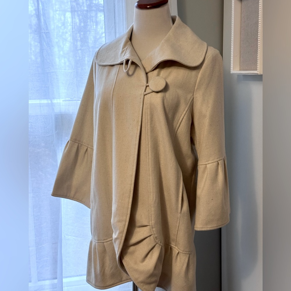 Wool ruffle hem and sleeve coat